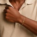 14K solid yellow gold men's Figaro chain bracelet lifestyle wrist shot