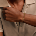 Man wearing 14K solid yellow gold Cuban link bracelet