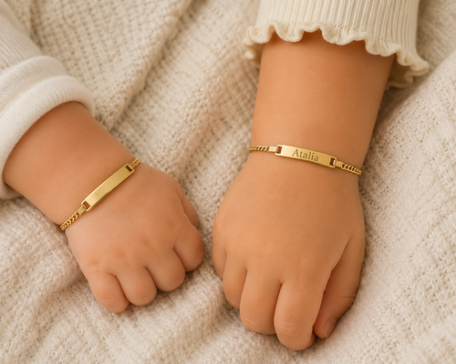 14K Solid Yellow Gold Baby Mariner ID Bracelet on baby wrists - plain and engraved