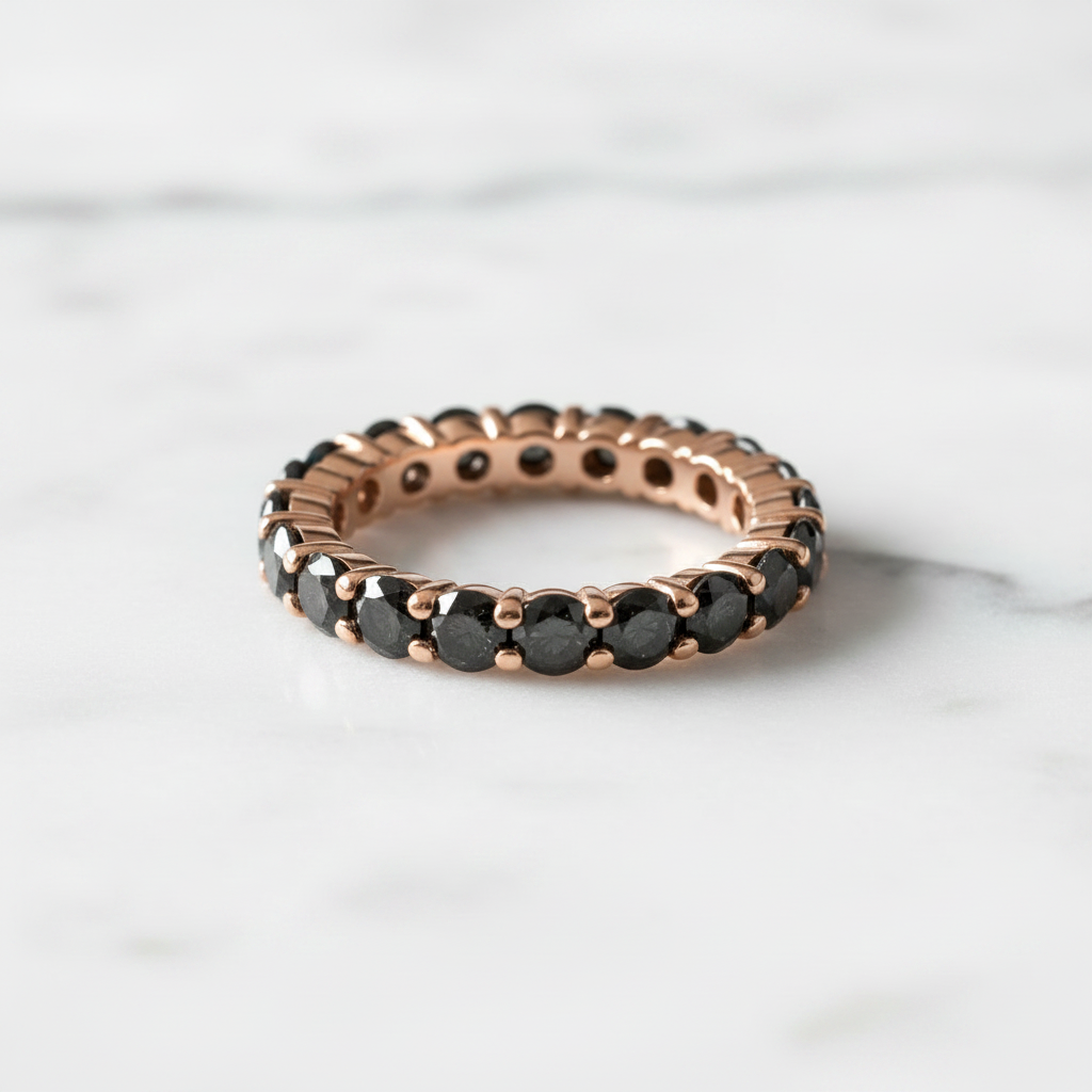 Black Diamond Eternity Ring in Rose Gold on marble